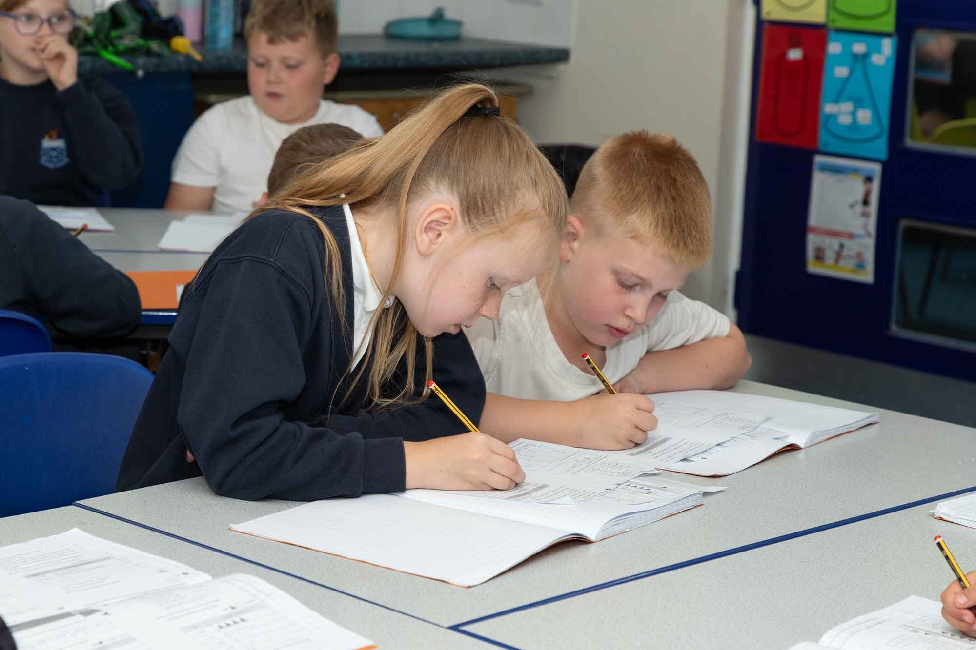 Children completing a maths test